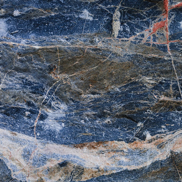 FX ‑ 155 Blue Rust Marble flexible marble panel showcasing a stormy navy‑blue background streaked with warm rust‑orange veins and flecks of white quartz, by Dunya Home Design.