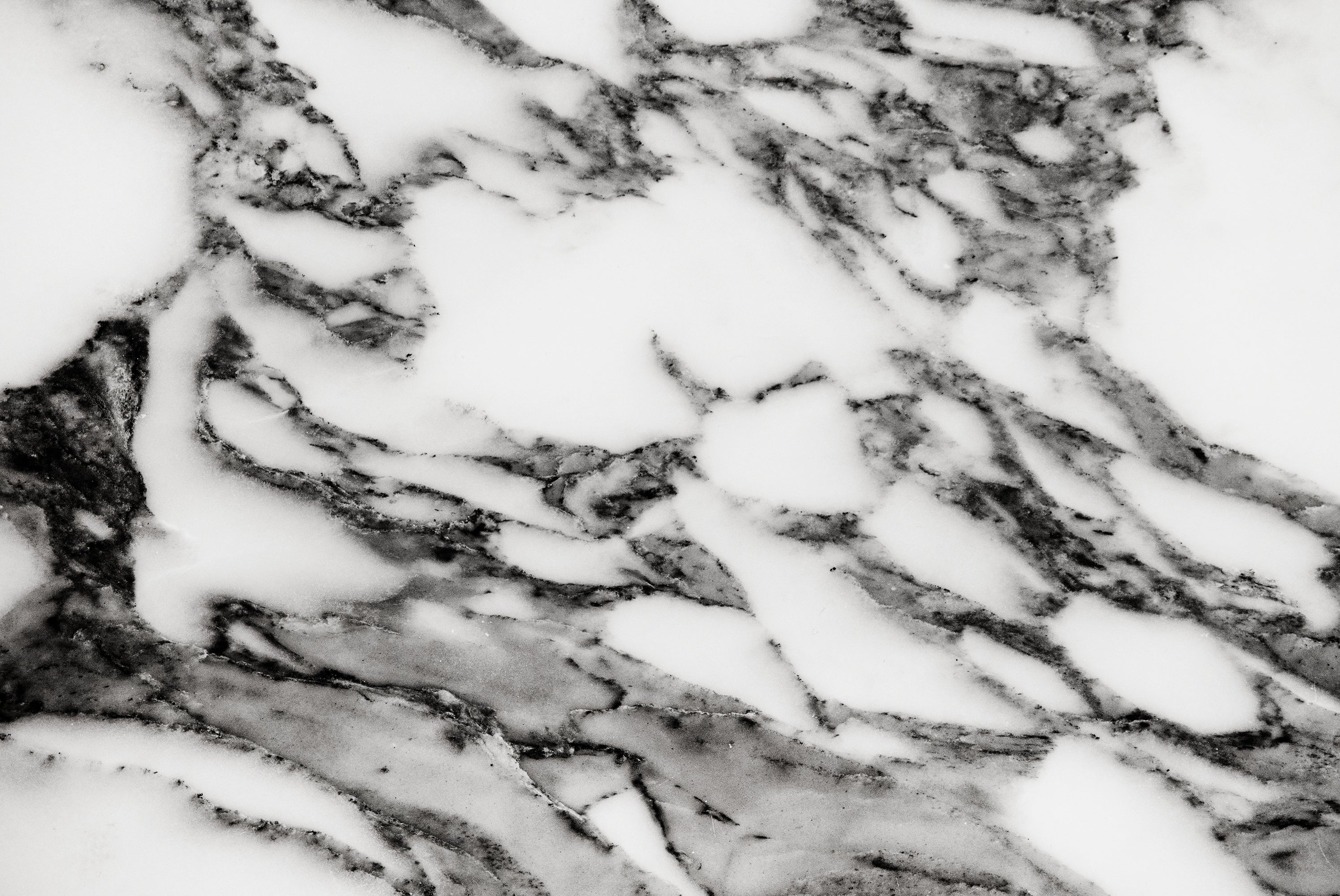 FX ‑ 158 Black Veined White Marble flexible marble panel showcasing a pristine white background crisscrossed with bold charcoal‑gray veining reminiscent of fine ink strokes, by Dunya Home Design.