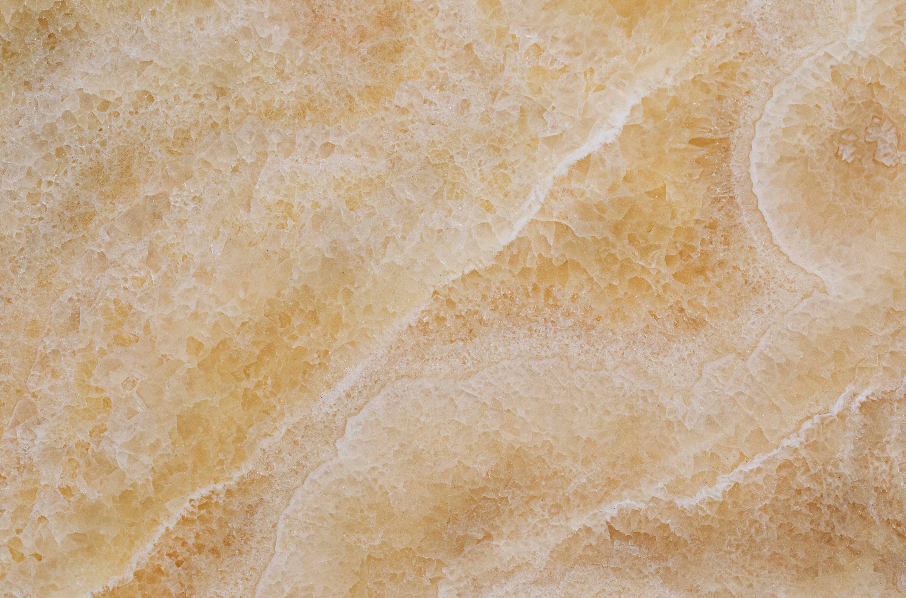 FX‑113 Golden Luxury flexible marble panel showcasing warm honey‑gold crystalline onyx textures with layered translucent bands and subtle white veining, by Dunya Home Design.