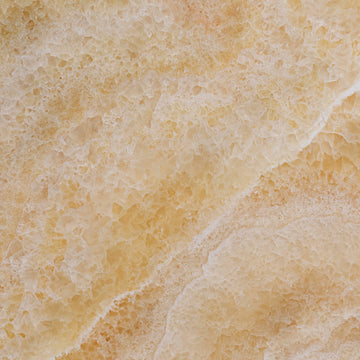 FX‑113 Golden Luxury flexible marble panel showcasing warm honey‑gold crystalline onyx textures with layered translucent bands and subtle white veining, by Dunya Home Design.