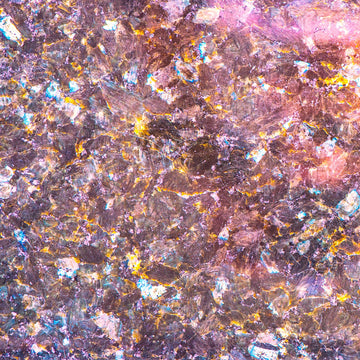 FX ‑ 135 Blush Nebula Marble flexible marble panel showcasing shimmering blush‑pink crystalline fragments interspersed with metallic gold veins and iridescent blue highlights, by Dunya Home Design.