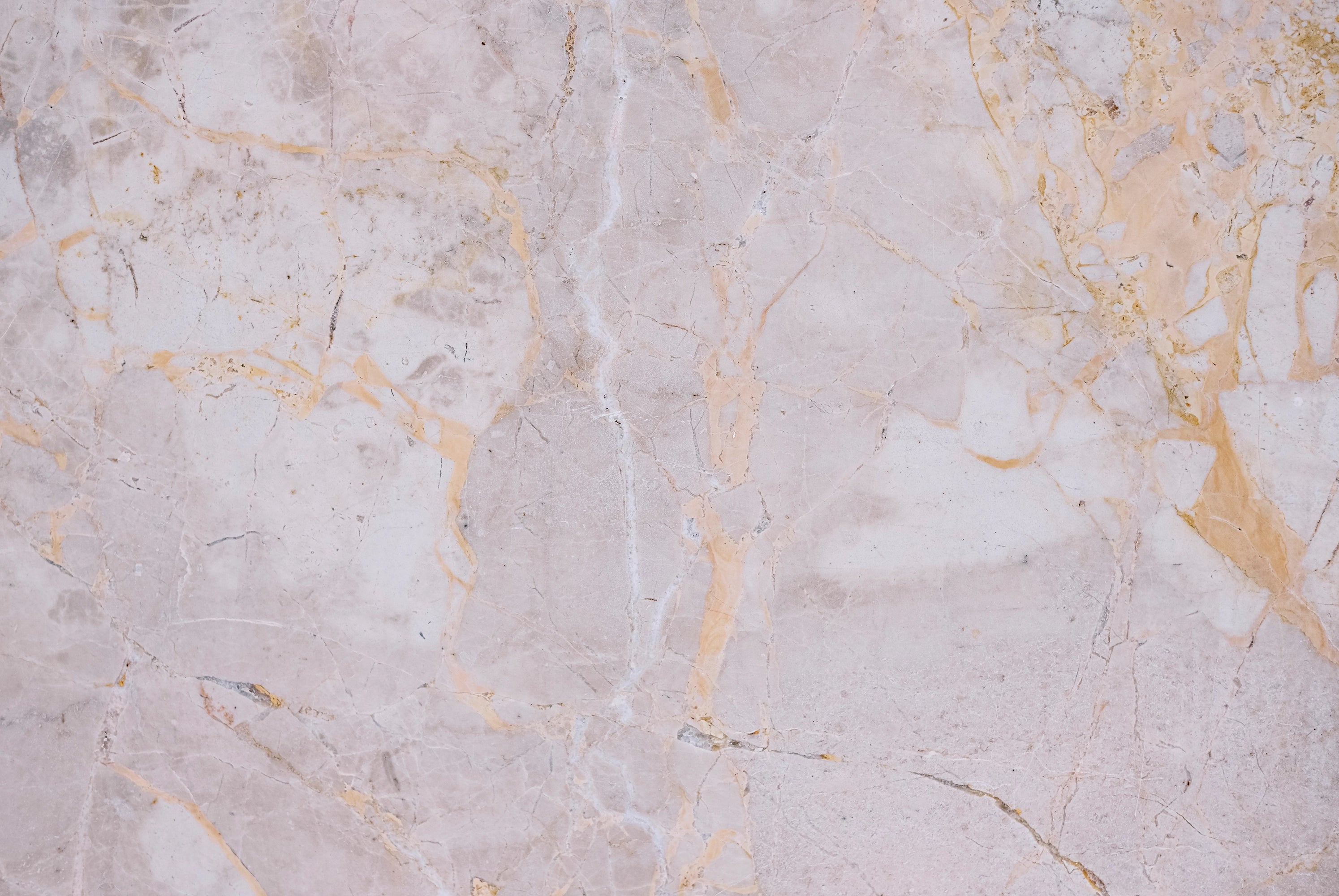 FX‑141 Honey Veil Marble flexible marble panel showcasing a soft blush‑grey background gently veined with delicate honey‑gold lines and subtle marbling textures, by Dunya Home Design