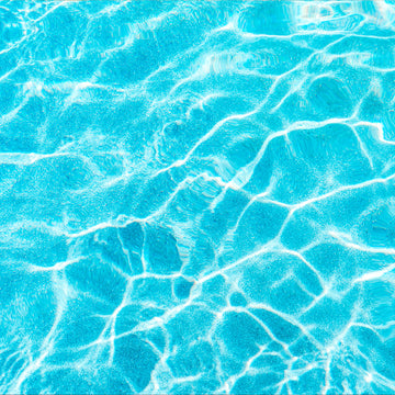 FX ‑ 154 Sunlit Ripples Set flexible marble panel showcasing a sunlit aqua‑blue water surface with shimmering white highlights and gentle, undulating ripple patterns, by Dunya Home Design.