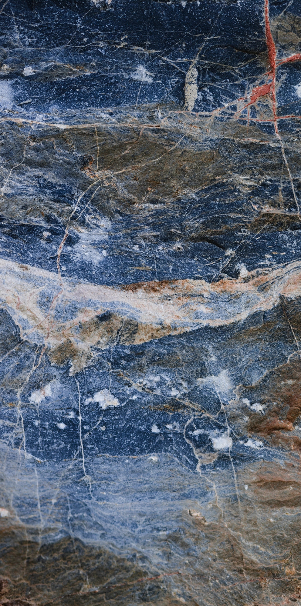 FX ‑ 155 Blue Rust Marble flexible marble panel showcasing a stormy navy‑blue background streaked with warm rust‑orange veins and flecks of white quartz, by Dunya Home Design.
