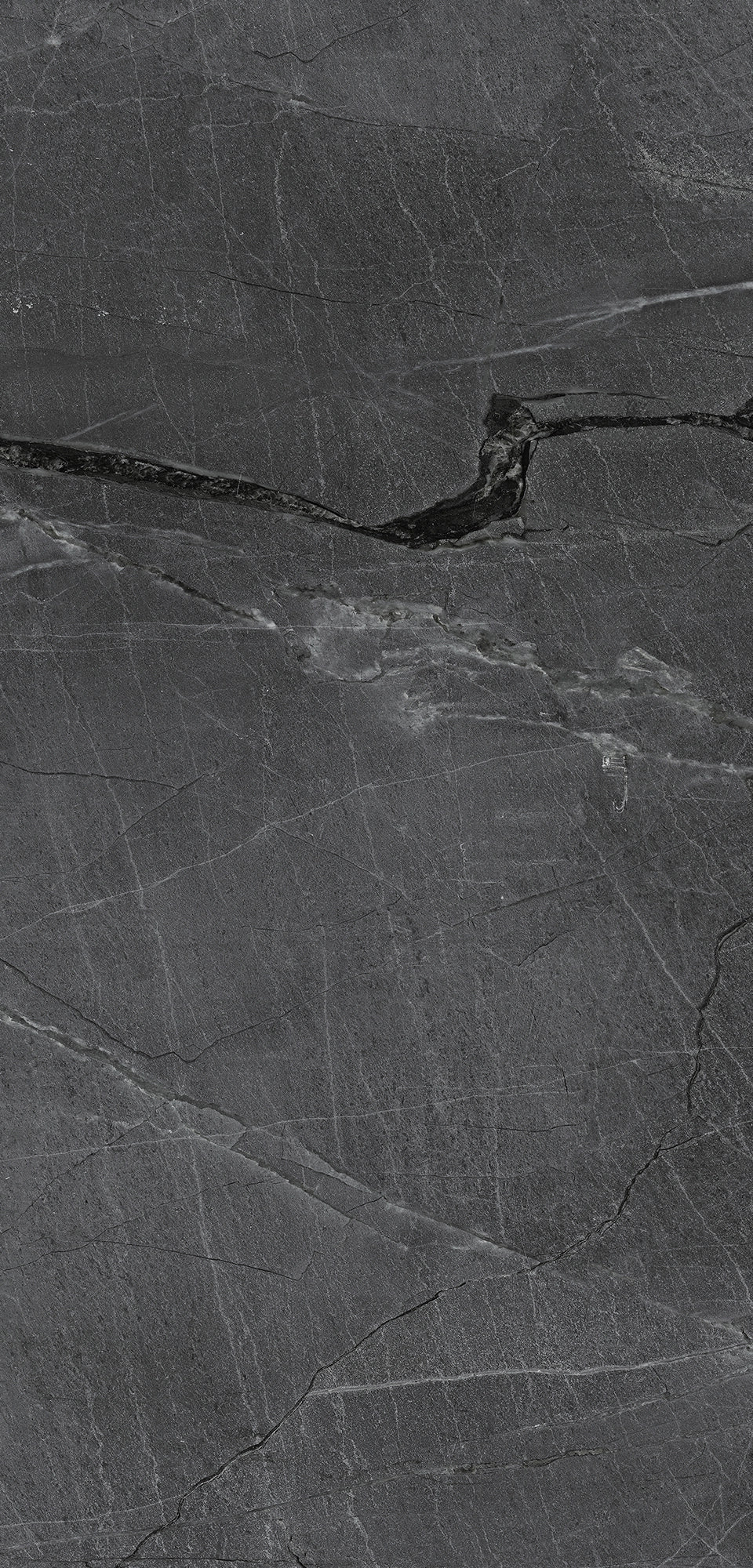FX‑187 Midnight Rift Set flexible marble panel showcasing a deep charcoal‑black background with subtle slate‑grey texture and striking jagged white and silver-grey fissures that evoke the look of a dramatic nighttime rift, by Dunya Home Design.