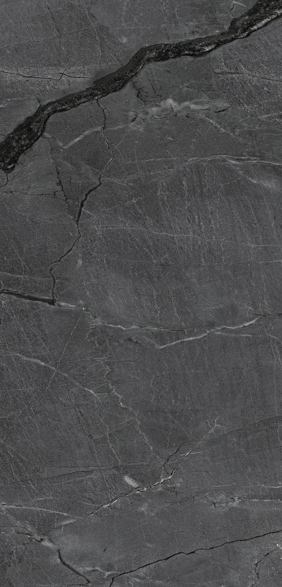FX‑187 Midnight Rift Set flexible marble panel showcasing a deep charcoal‑black background with subtle slate‑grey texture and striking jagged white and silver-grey fissures that evoke the look of a dramatic nighttime rift, by Dunya Home Design.