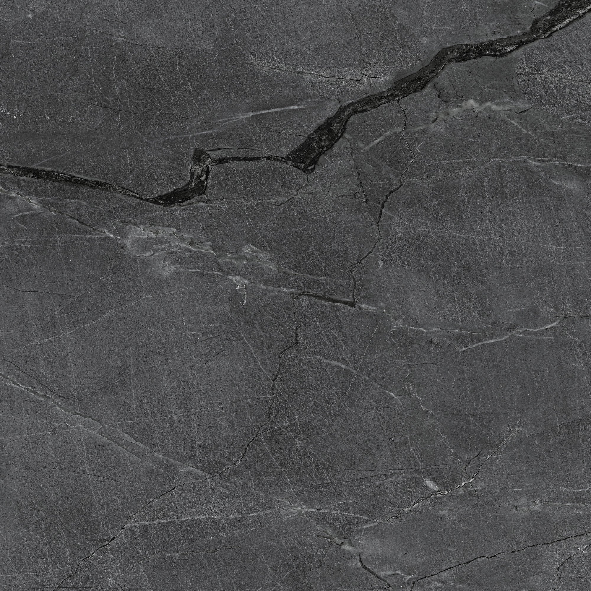 FX‑187 Midnight Rift Set flexible marble panel showcasing a deep charcoal‑black background with subtle slate‑grey texture and striking jagged white and silver-grey fissures that evoke the look of a dramatic nighttime rift, by Dunya Home Design.