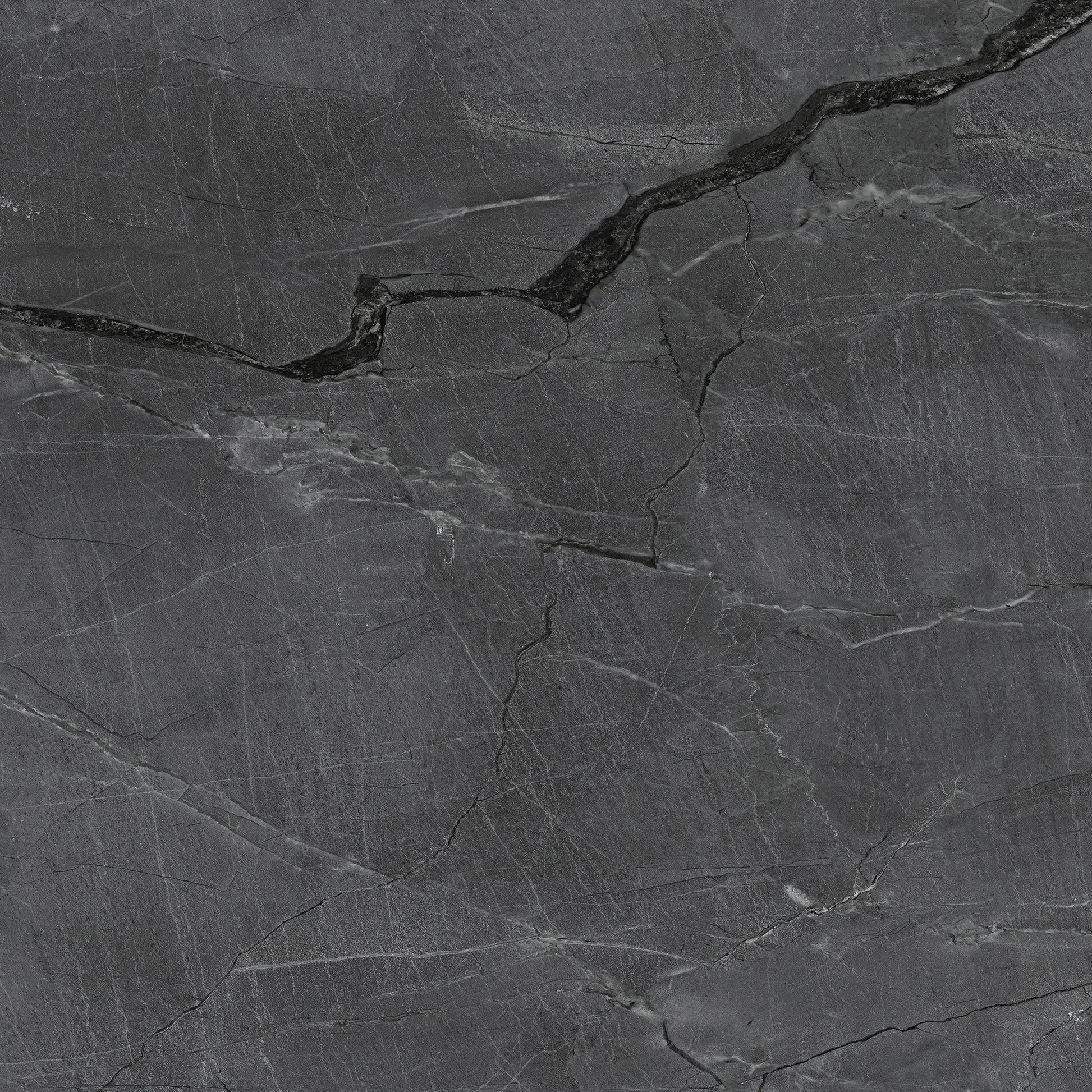 FX‑187 Midnight Rift Set flexible marble panel showcasing a deep charcoal‑black background with subtle slate‑grey texture and striking jagged white and silver-grey fissures that evoke the look of a dramatic nighttime rift, by Dunya Home Design.