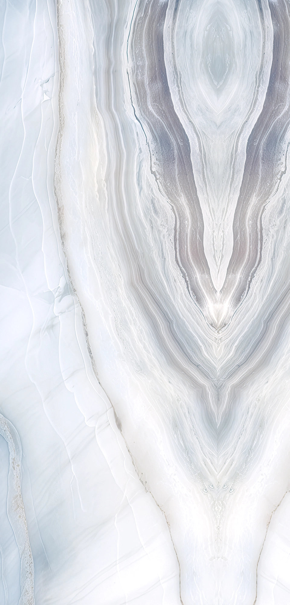 FX‑188 Glacial Mirage Set flexible marble panel showcasing a luminous white background with soft, translucent ice‑blue and silvery‑grey striations forming a mirrored, crystalline pattern reminiscent of frozen layers, by Dunya Home Design.