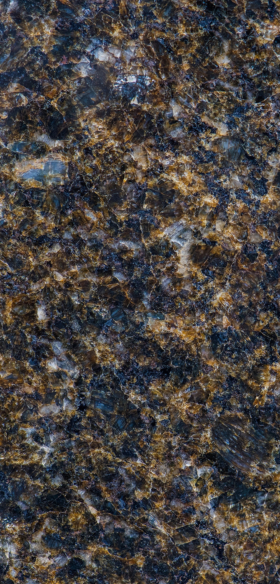 FX‑190 Midnight Ember Granite flexible granite panel showcasing a deep, near‑black background laced with iridescent midnight‑blue and smoky grey mineral flecks, interspersed with warm amber‑gold highlights that create a subtle, ember‑like glow, by Dunya Home Design.