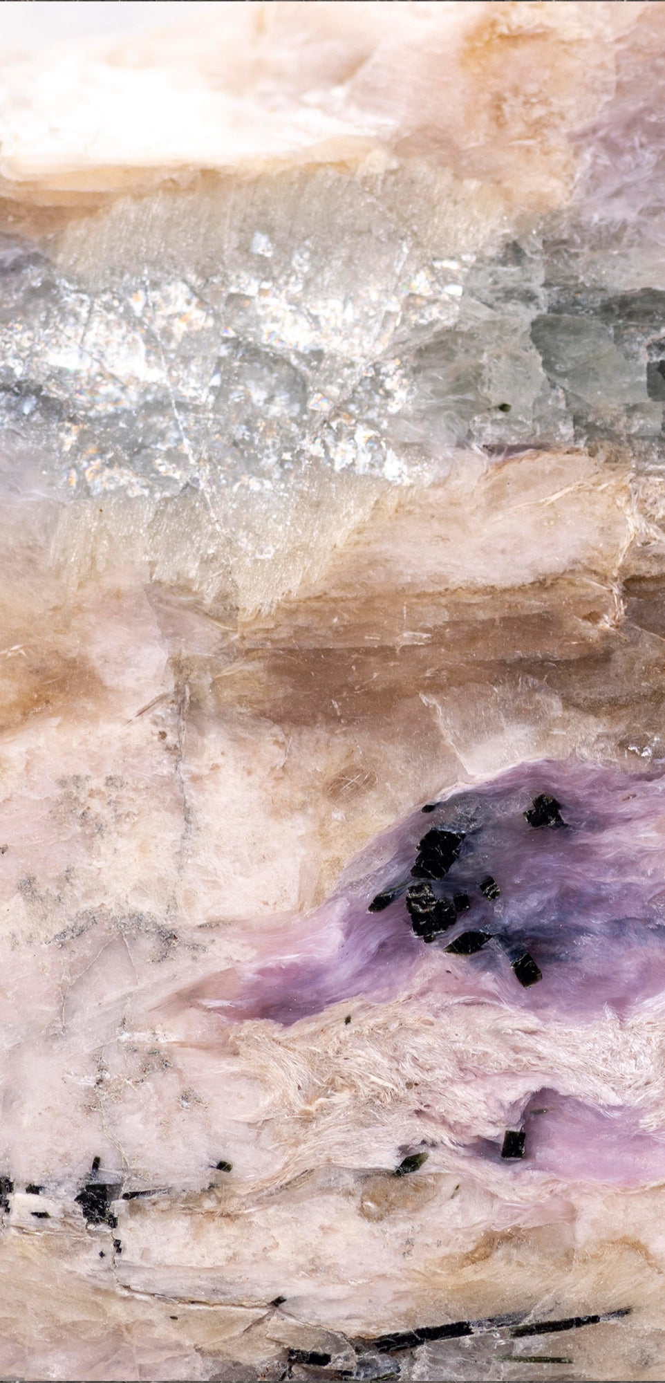 FX ‑ 161 Lavender Strata Marble flexible marble panel showcasing layered cream‑beige and warm taupe striations punctuated by wispy lavender‑purple veins, glimmering silvery crystal pockets, and scattered ebony mineral flecks, by Dunya Home Design.