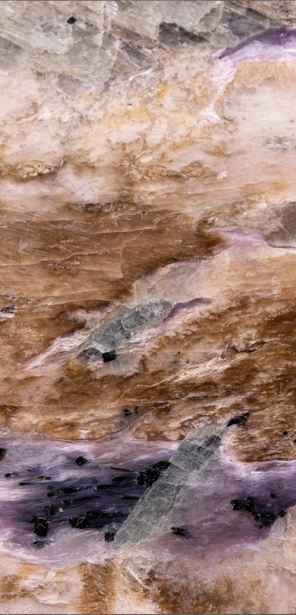 FX ‑ 161 Lavender Strata Marble flexible marble panel showcasing layered cream‑beige and warm taupe striations punctuated by wispy lavender‑purple veins, glimmering silvery crystal pockets, and scattered ebony mineral flecks, by Dunya Home Design.