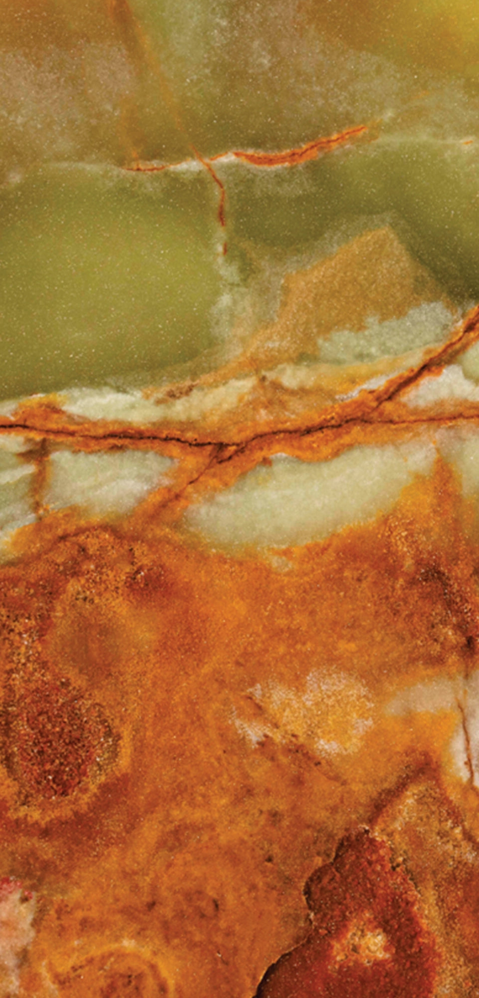 FX‑022 Onice Verde Fiamma flexible marble panel close‑up showing translucent olive‑green base with fiery orange‑red veins and creamy white banding, by Dunya Home Design