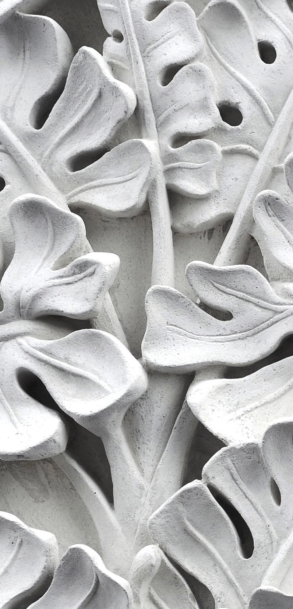 FX‑111 Ceramic Leaf Motif flexible marble panel featuring embossed white ceramic‑inspired tropical leaf and flower relief patterns with fine surface texture, by Dunya Home Design.