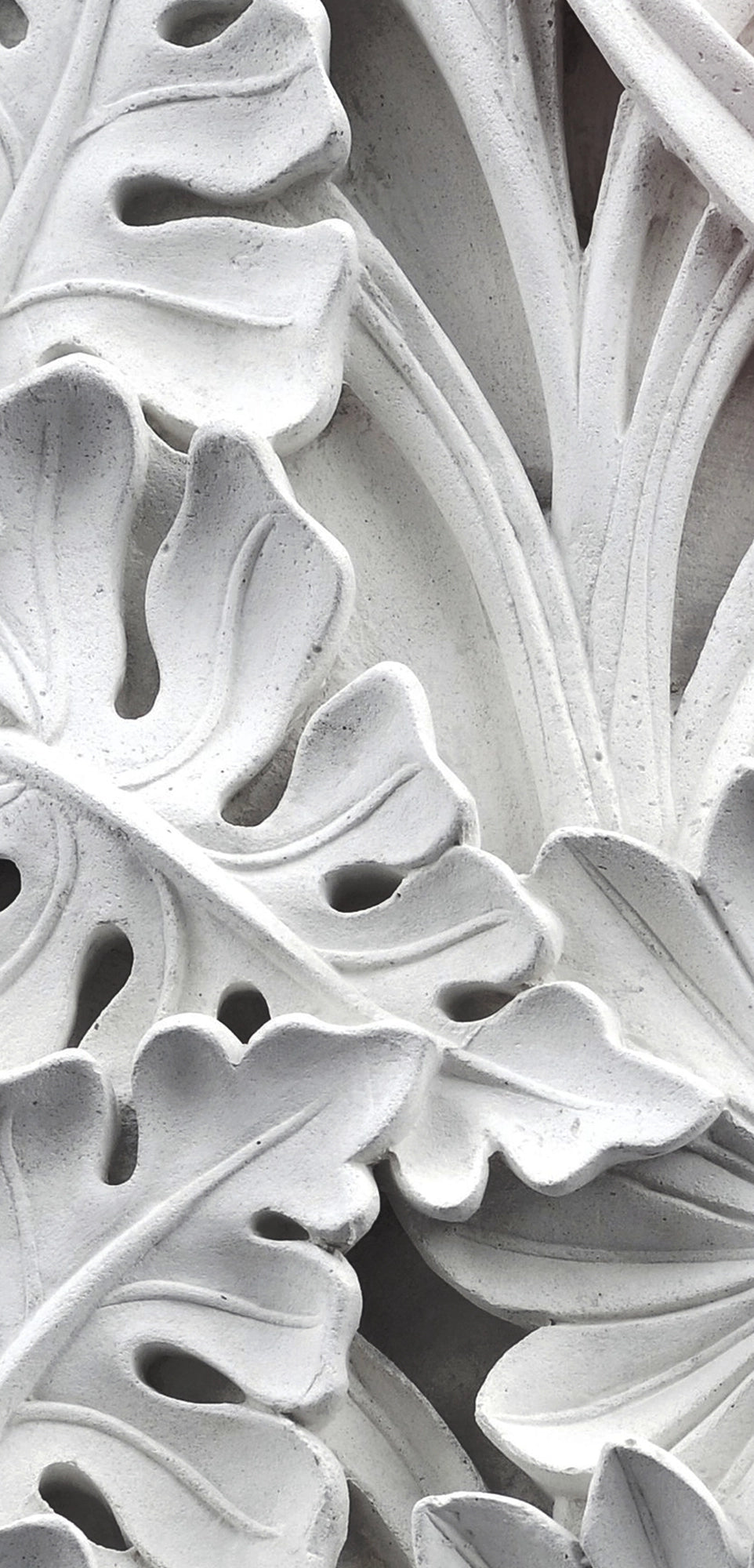 FX‑111 Ceramic Leaf Motif flexible marble panel featuring embossed white ceramic‑inspired tropical leaf and flower relief patterns with fine surface texture, by Dunya Home Design.