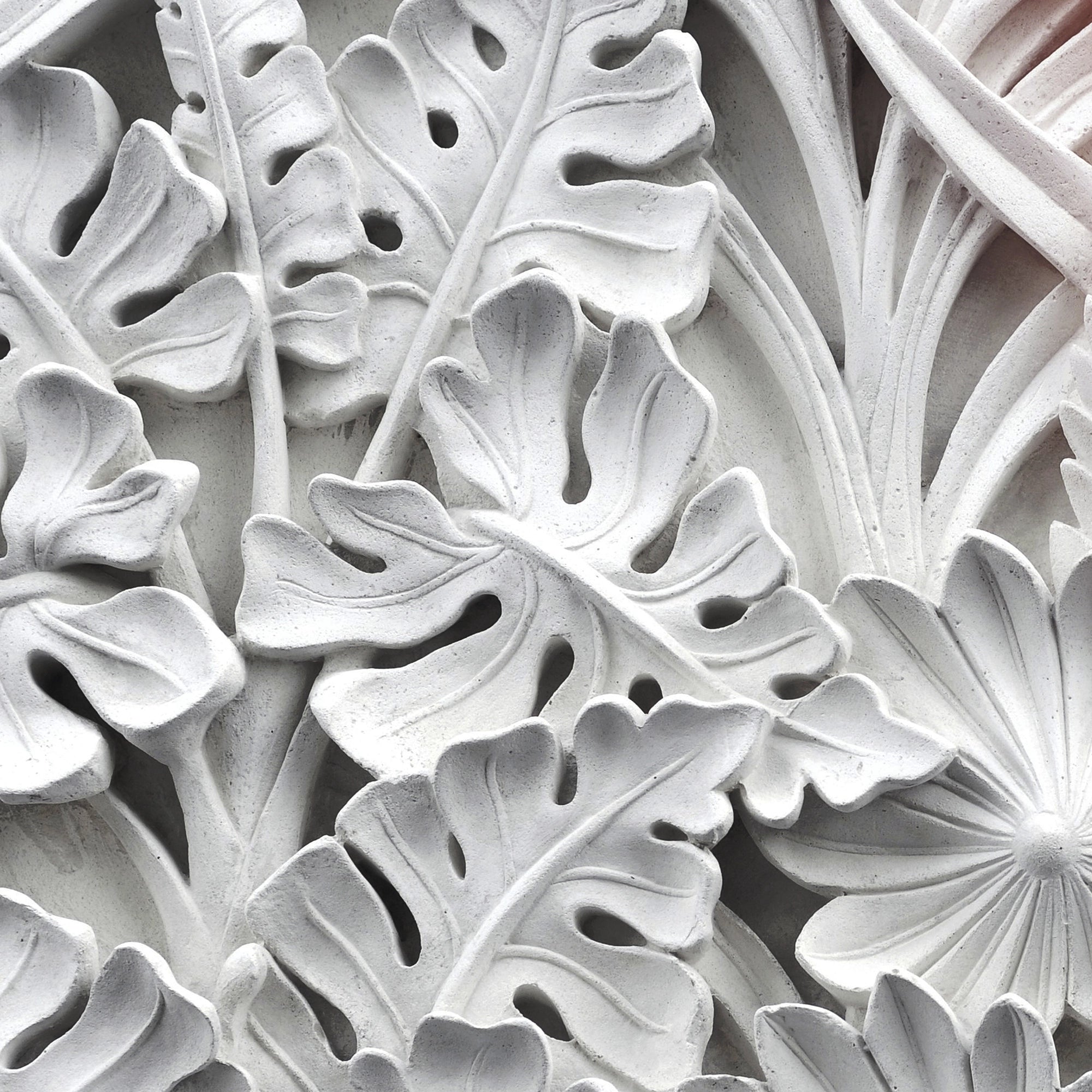 FX‑111 Ceramic Leaf Motif flexible marble panel featuring embossed white ceramic‑inspired tropical leaf and flower relief patterns with fine surface texture, by Dunya Home Design.