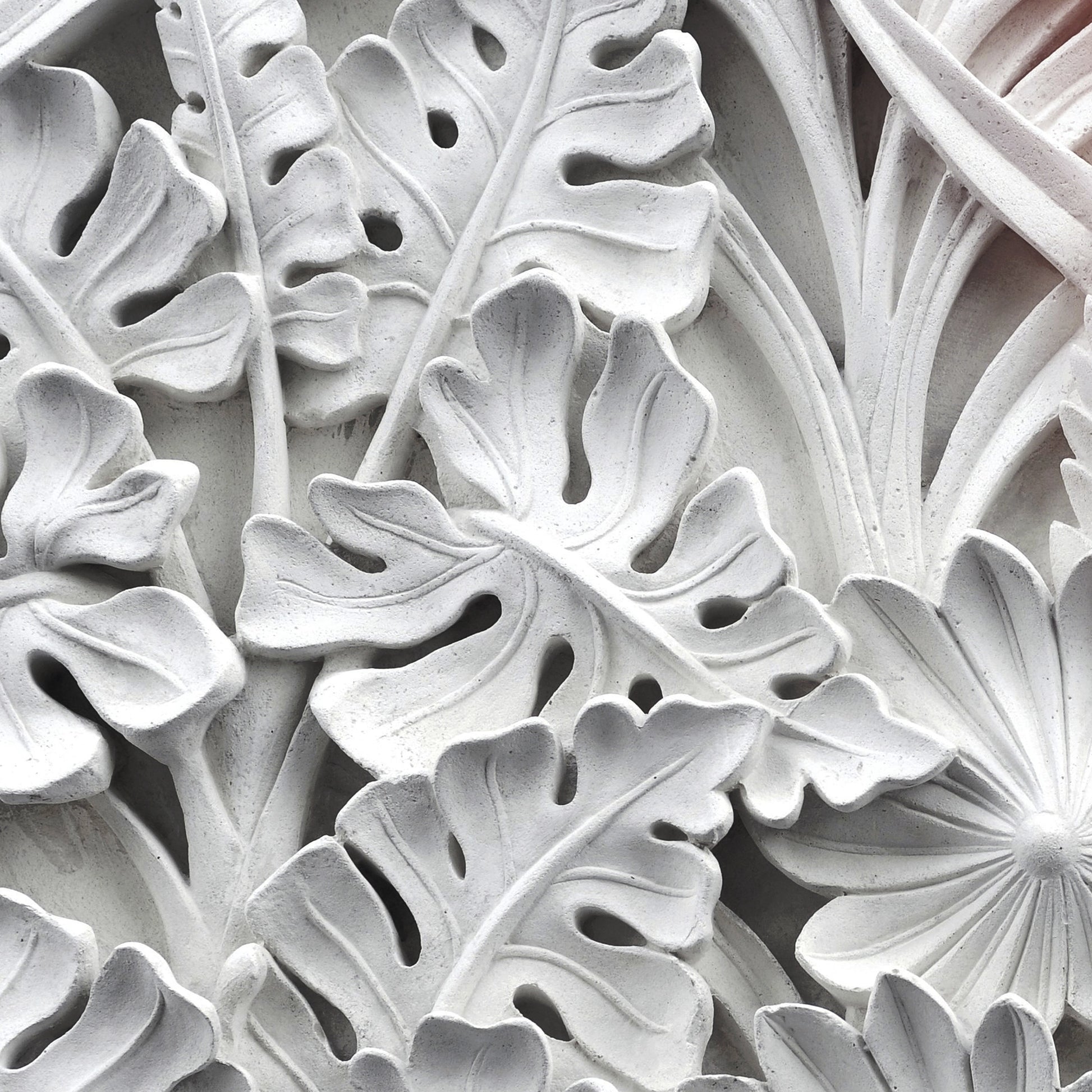 FX‑111 Ceramic Leaf Motif flexible marble panel featuring embossed white ceramic‑inspired tropical leaf and flower relief patterns with fine surface texture, by Dunya Home Design.