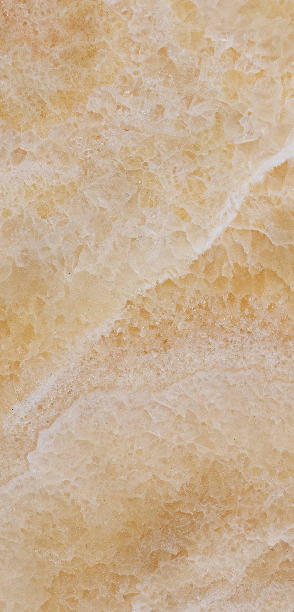 FX‑113 Golden Luxury flexible marble panel showcasing warm honey‑gold crystalline onyx textures with layered translucent bands and subtle white veining, by Dunya Home Design.