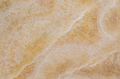 FX‑113 Golden Luxury flexible marble panel showcasing warm honey‑gold crystalline onyx textures with layered translucent bands and subtle white veining, by Dunya Home Design.