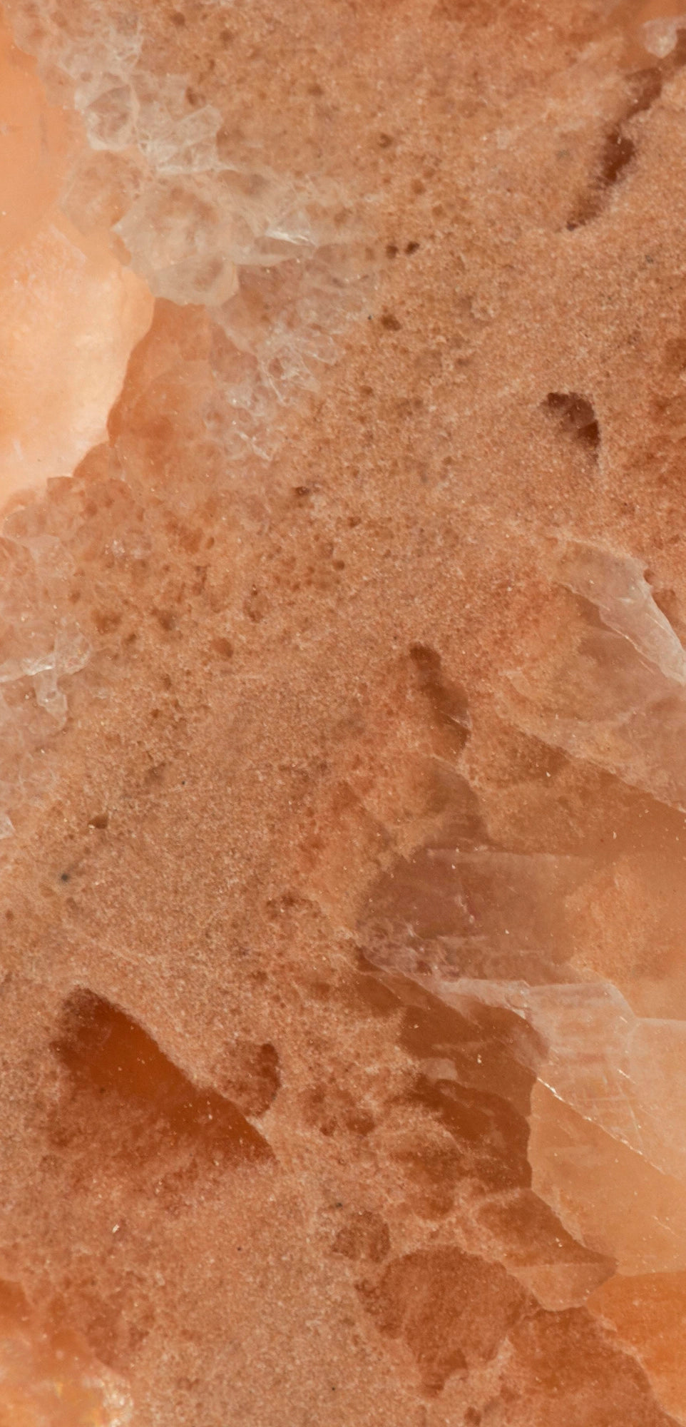 FX‑136 Coral Sands Marble flexible marble panel showcasing warm coral‑orange onyx clusters with translucent crystal formations and sandy-textured layers, by Dunya Home Design.