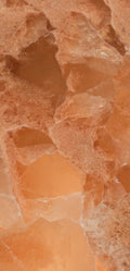 FX‑136 Coral Sands Marble flexible marble panel showcasing warm coral‑orange onyx clusters with translucent crystal formations and sandy-textured layers, by Dunya Home Design.