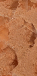 FX‑136 Coral Sands Marble flexible marble panel showcasing warm coral‑orange onyx clusters with translucent crystal formations and sandy-textured layers, by Dunya Home Design.