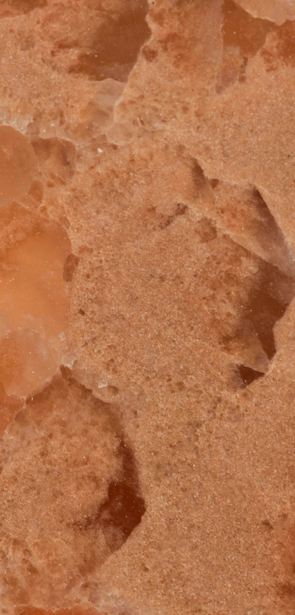 FX‑136 Coral Sands Marble flexible marble panel showcasing warm coral‑orange onyx clusters with translucent crystal formations and sandy-textured layers, by Dunya Home Design.