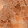 FX‑136 Coral Sands Marble flexible marble panel showcasing warm coral‑orange onyx clusters with translucent crystal formations and sandy-textured layers, by Dunya Home Design.