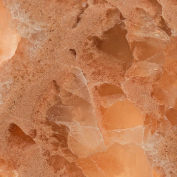 FX‑136 Coral Sands Marble flexible marble panel showcasing warm coral‑orange onyx clusters with translucent crystal formations and sandy-textured layers, by Dunya Home Design.