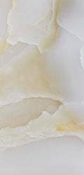 FX‑137 Golden Dawn Marble flexible marble panel showcasing luminous white and pale cream onyx layers with gentle golden-yellow highlights and soft translucent textures, by Dunya Home Design.