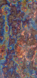 FX‑138 Prism Patina Marble flexible marble panel showcasing iridescent rainbow patina effects with mottled rust and metallic textures, by Dunya Home Design.