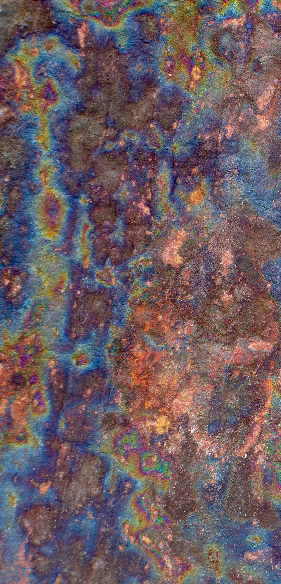 FX‑138 Prism Patina Marble flexible marble panel showcasing iridescent rainbow patina effects with mottled rust and metallic textures, by Dunya Home Design.