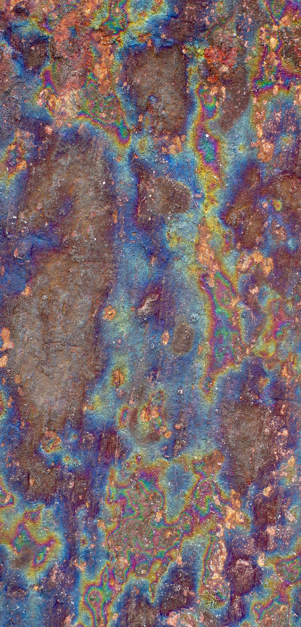 FX‑138 Prism Patina Marble flexible marble panel showcasing iridescent rainbow patina effects with mottled rust and metallic textures, by Dunya Home Design.