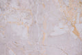 FX‑141 Honey Veil Marble flexible marble panel showcasing a soft blush‑grey background gently veined with delicate honey‑gold lines and subtle marbling textures, by Dunya Home Design
