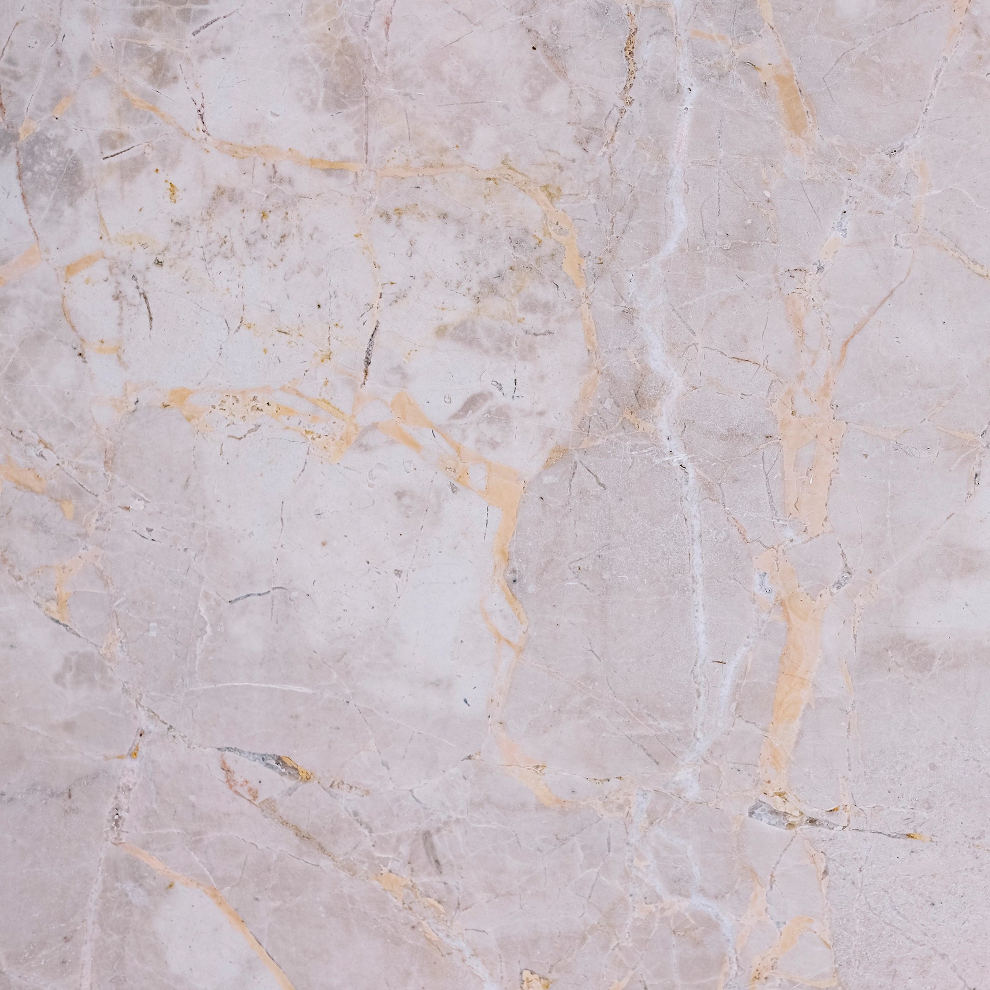 FX‑141 Honey Veil Marble flexible marble panel showcasing a soft blush‑grey background gently veined with delicate honey‑gold lines and subtle marbling textures, by Dunya Home Design