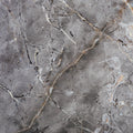 FX‑142 Iron Vein Marble flexible marble panel featuring a cool mid‑grey base streaked with bold white and rust‑orange veins, accented by fine iron‑speckled textures for an industrial yet elegant look, by Dunya Home Design.