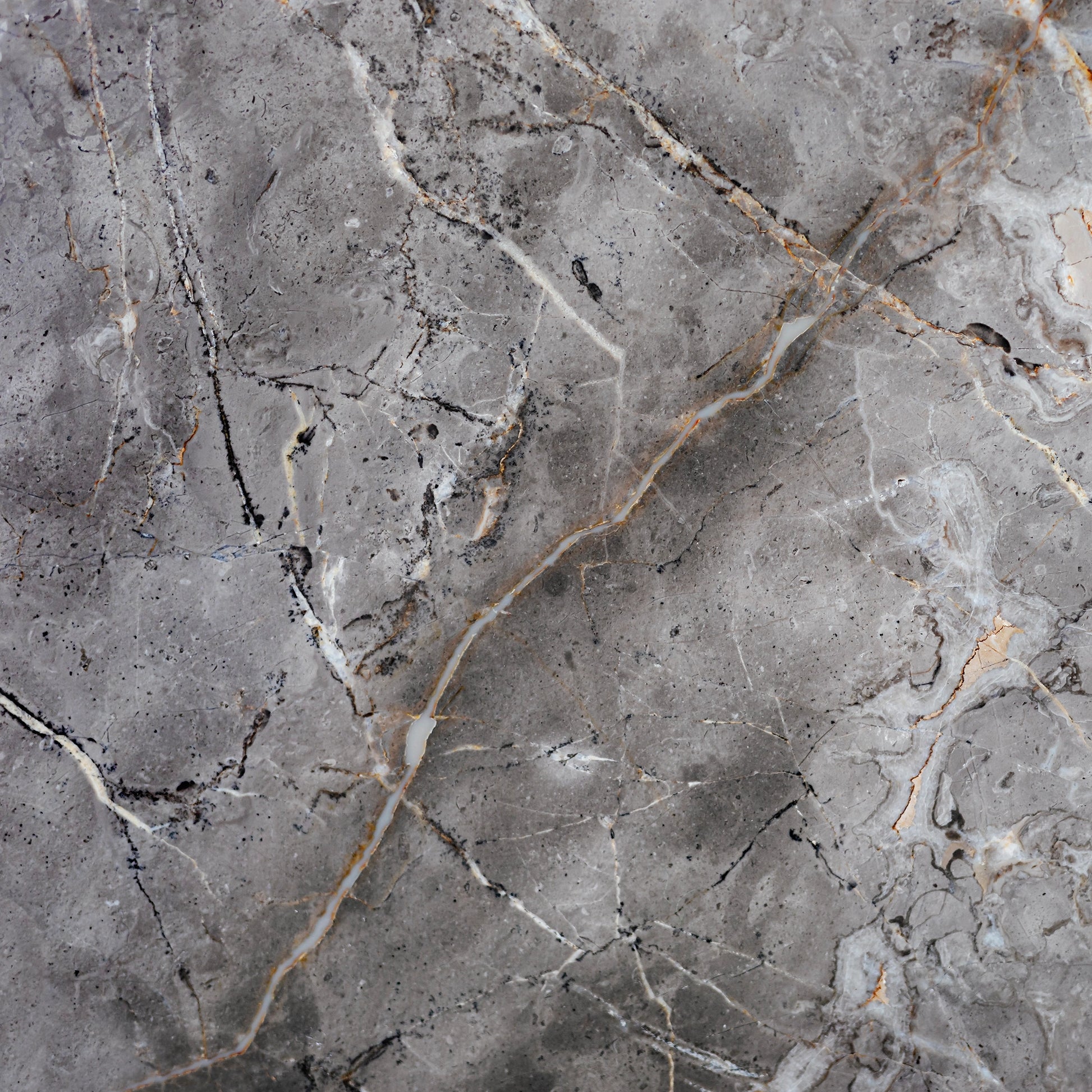 FX‑142 Iron Vein Marble flexible marble panel featuring a cool mid‑grey base streaked with bold white and rust‑orange veins, accented by fine iron‑speckled textures for an industrial yet elegant look, by Dunya Home Design.