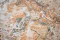 “FX‑147 Rust Tide Marble” flexible panel by Dunya Home Design: an abstract marble pattern in creamy white with swirling patches of rust orange, burnished copper, and silvery gray that blend in fluid, tide‑like currents across the surface.