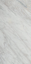 “FX‑149 Arctic Drift Marble” flexible panel by Dunya Home Design: a cool white marble ground shot through with soft, brush‑stroke swaths of pale gray‑blue and taupe that fan out diagonally, accented by fine, delicate hairline veins of warm gold.