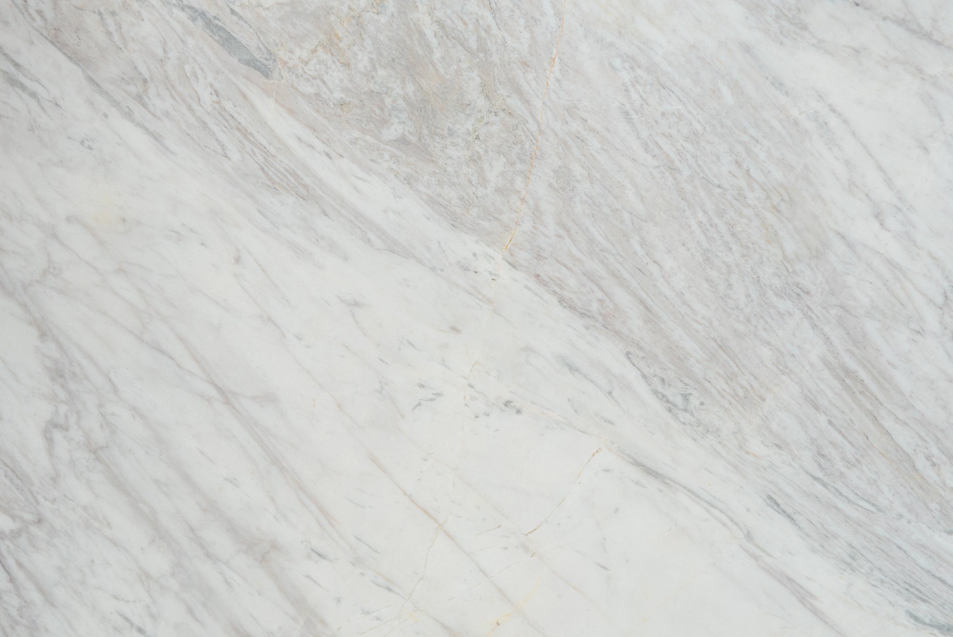 “FX‑149 Arctic Drift Marble” flexible panel by Dunya Home Design: a cool white marble ground shot through with soft, brush‑stroke swaths of pale gray‑blue and taupe that fan out diagonally, accented by fine, delicate hairline veins of warm gold.