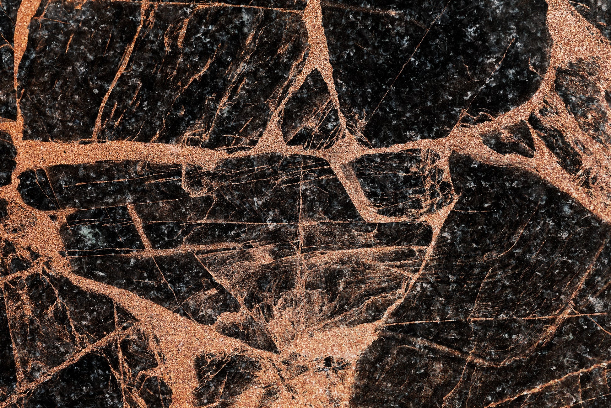 “FX‑151 Midnight Copper Marble” flexible panel by Dunya Home Design: deep black marble background shot through with bold, metallic copper veins and shimmering flecks, creating a dramatic contrast of dark and warm metallic tones with an intricate, fractured pattern.
