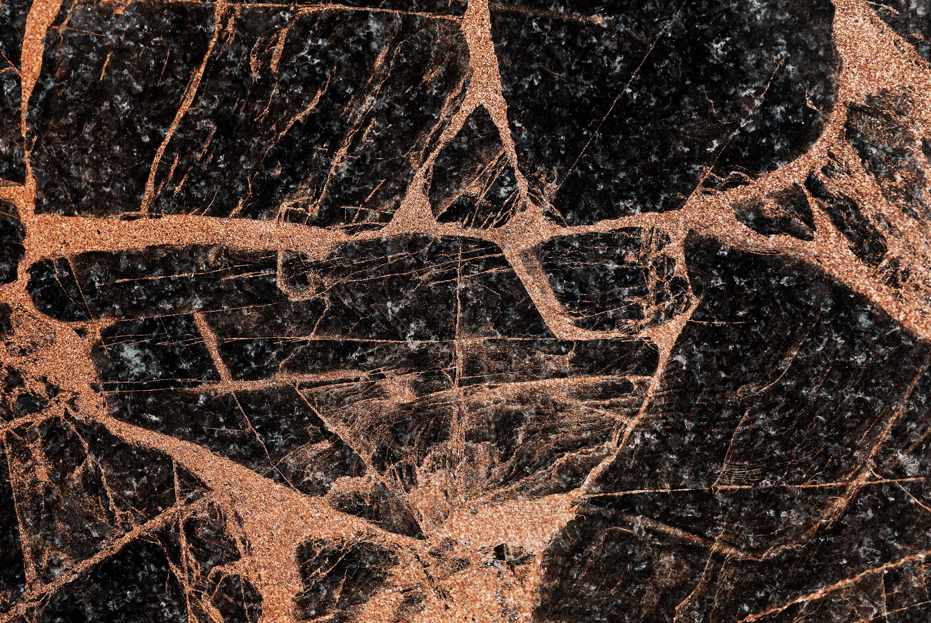“FX‑151 Midnight Copper Marble” flexible panel by Dunya Home Design: deep black marble background shot through with bold, metallic copper veins and shimmering flecks, creating a dramatic contrast of dark and warm metallic tones with an intricate, fractured pattern.
