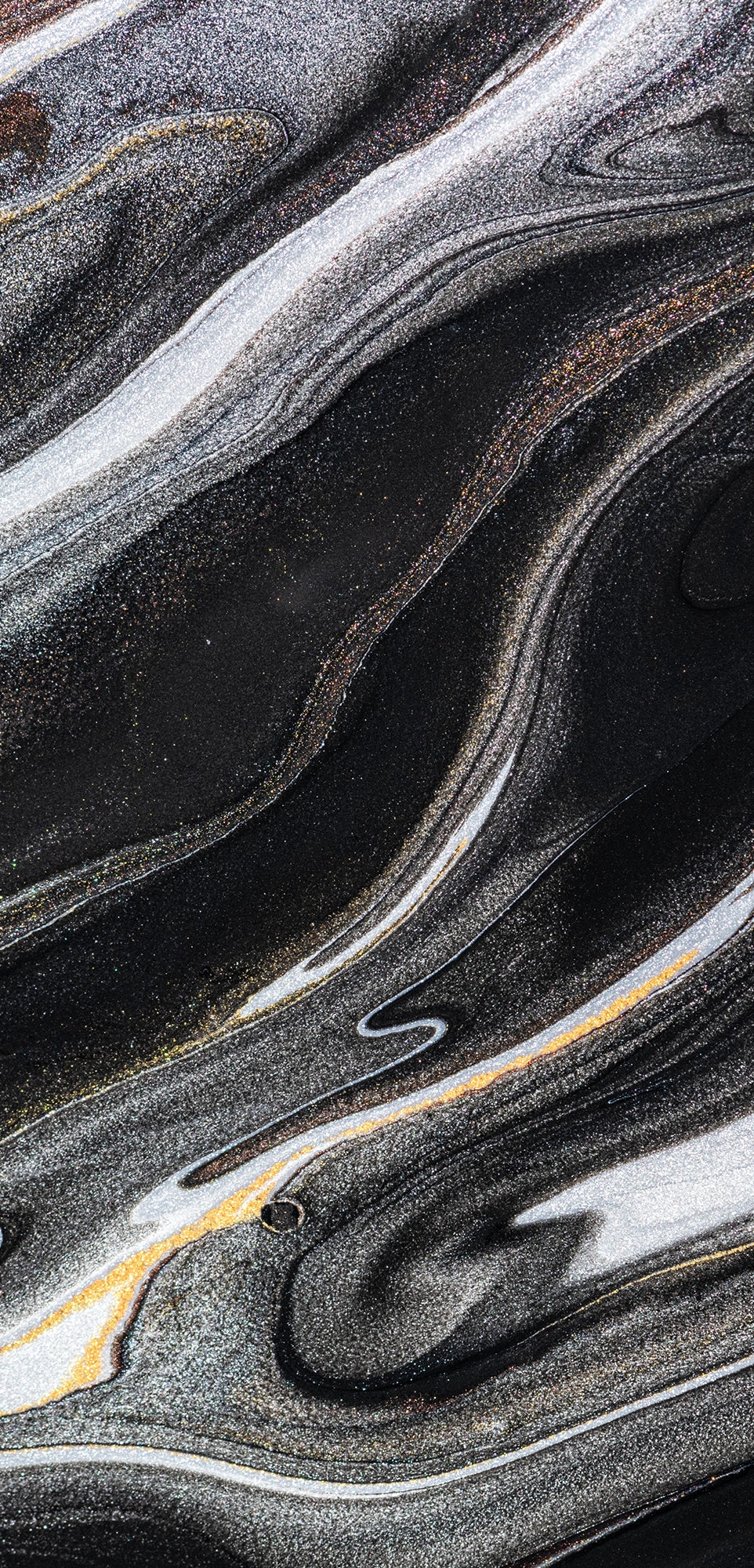 “FX‑152 Obsidian Flow Marble” flexible panel by Dunya Home Design: a dynamic, fluid pattern of swirling deep black base streaked with metallic silver and warm copper‑gold accents, creating a glossy, marble‑like surface with glittering, flowing veins.