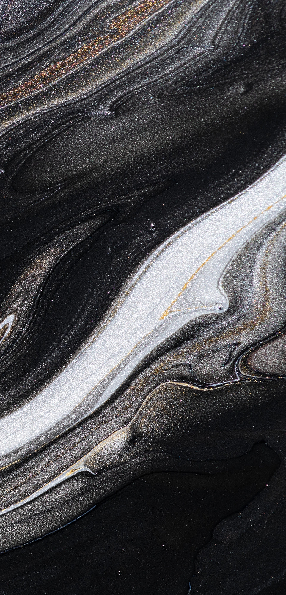“FX‑152 Obsidian Flow Marble” flexible panel by Dunya Home Design: a dynamic, fluid pattern of swirling deep black base streaked with metallic silver and warm copper‑gold accents, creating a glossy, marble‑like surface with glittering, flowing veins.
