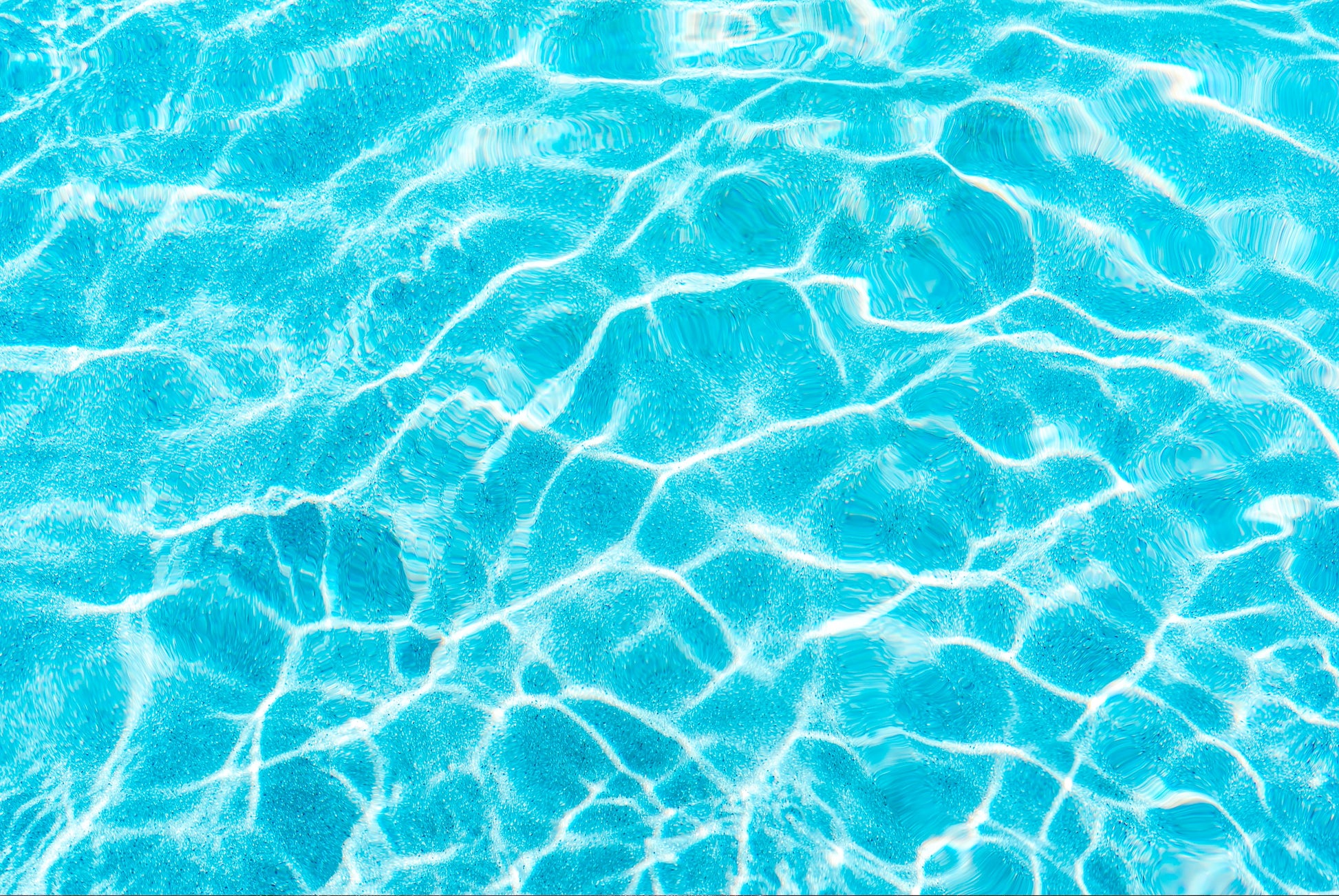 FX ‑ 154 Sunlit Ripples Set flexible marble panel showcasing a sunlit aqua‑blue water surface with shimmering white highlights and gentle, undulating ripple patterns, by Dunya Home Design.