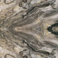 FX ‑ 170 Mirrored Smoke Onyx Marble flexible marble panel showcasing a perfectly book‑matched, mirrored onyx pattern of smoky grey and charcoal bands radiating from the center, accented by wispy ivory veins and flecks of warm gold, by Dunya Home Design.