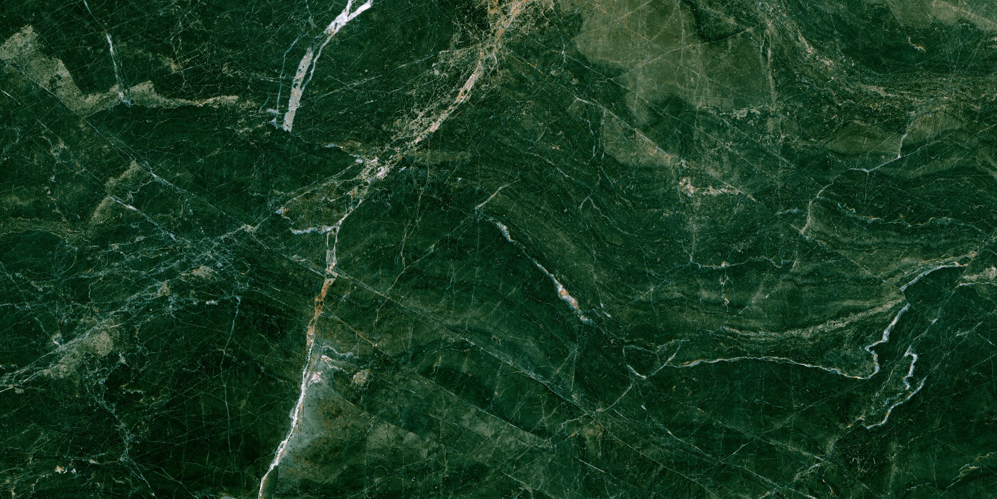 FX ‑ 176 Forest Veil Marble flexible marble panel showcasing a deep emerald‑green base veined with fine white lines and warm amber streaks that meander like sunlit paths through a woodland canopy, by Dunya Home Design.