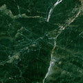 FX ‑ 176 Forest Veil Marble flexible marble panel showcasing a deep emerald‑green base veined with fine white lines and warm amber streaks that meander like sunlit paths through a woodland canopy, by Dunya Home Design.