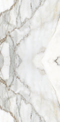 FX ‑ 180 Auric Prism Calacatta Marble flexible marble panel showcasing a luminous white Calacatta background book‑matched into a central diamond prism motif with soft gray and warm gold veins radiating outward like molten metal highlights, by Dunya Home Design.
