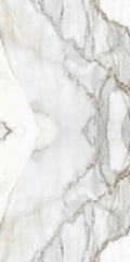 FX ‑ 180 Auric Prism Calacatta Marble flexible marble panel showcasing a luminous white Calacatta background book‑matched into a central diamond prism motif with soft gray and warm gold veins radiating outward like molten metal highlights, by Dunya Home Design.
